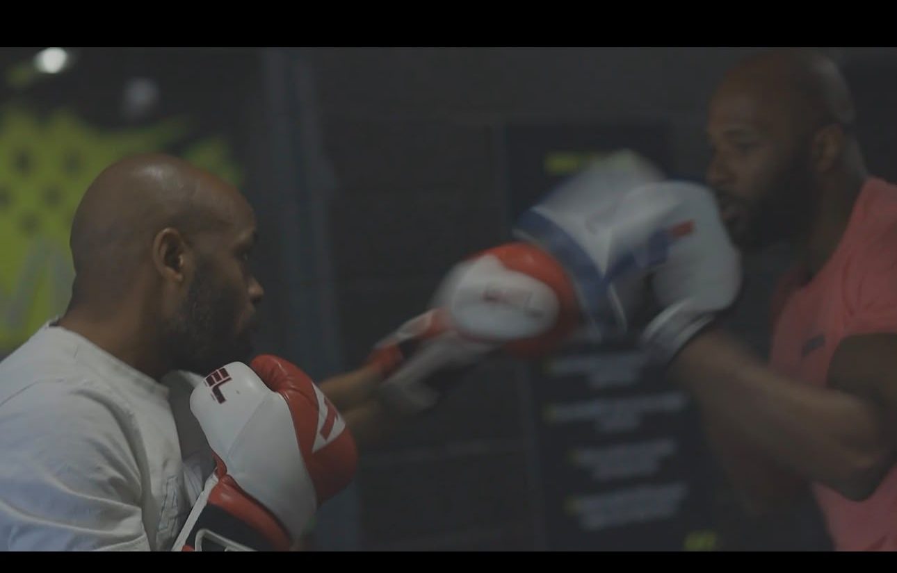 Coach Tae running mitt work in the gym